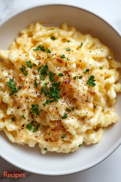 This authentic Käsespätzle (German macaroni and cheese) recipe brings you the perfect comfort food made with homemade spaetzle, Emmentaler cheese, and caramelized onions. A delicious twist on traditional macaroni and cheese. German Side Dishes, German Dinner, Italian Main Dishes, Germany Food, Homemade Egg Noodles, Macaroni And Cheese Recipe, Macaroni N Cheese Recipe, Homemade Noodles, German Recipes