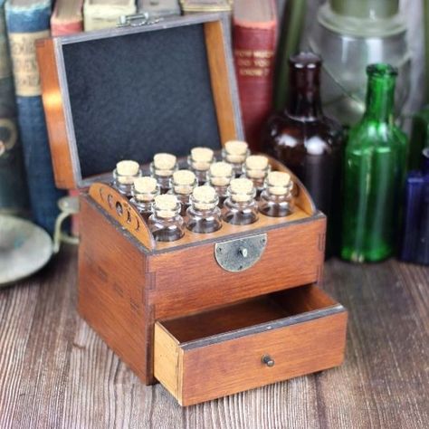 Wooden apothecary chest/storage box with drawer, comes with 12 glass bottles, cork stoppers and labels: ($92-$105) Sold by: https://www.etsy.com/shop/ReginaldSpleen Item in picture: https://www.etsy.com/listing/1073555316/wooden-apothecary-chest-with-drawer-for #wood #woodwork #apothecary #woodenchest #chest #storagebox #potionbottlebox #potionbottles #corkedbottles #drawerchest #etsy #etsyfinds #etsyshop #etsy Essential Oil Storage Box, Apothecary Chest, Essential Oil Storage, Handmade Wooden Boxes, Good Birthday Presents, Oil Storage, Cork Lid, Essential Oil Bottles, Cork Stoppers