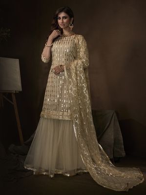 The outfit also includes a matching soft net bottom in off-white and a net dupatta. White Sharara, Sharara Style, Designer Sharara, Gharara Suits, Embroidered Sharara, Sharara Suits, Dresses Dinner Party, Dresses Dinner, Gaun Fashion