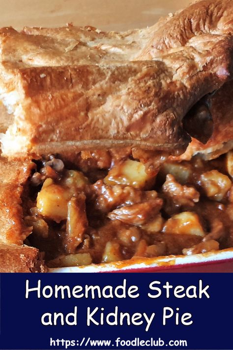 Homemade steak and kidney pie, topped with crispy puff pastry and overflowing with succulent chunks of steak and kidney. Served on a pile of fluffy mashed potatoes with juicy peas on the side - this is comfort food at its finest! #steakandkidney #steakandkidneypie #pies #comfortfood #homemade Beef And Kidney Pie, Steak Kidney Pie, Steak And Kidney Stew, Steak And Kidney Pie Recipe British, Steak And Kidney Pie Recipe South Africa, Steak And Kidney Pie Recipe, Kidney Pie Recipe, English Pie, Steak Stew