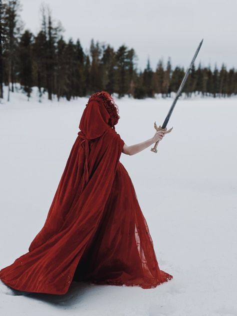 Snow White Dress Gowns, Dark Snow White Aesthetic, Winter Fairytale Aesthetic, Red Cloak Aesthetic, Red Dress In Snow, Red Cape Aesthetic, Red Knight Aesthetic, Red Princess Dress Fairytale, Lady In Red Aesthetic