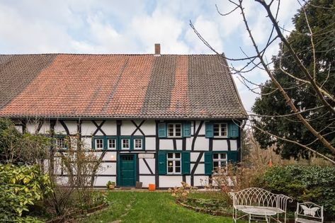 Photo 1 of 30 in A 200-Year-Old German Farmhouse Gets a Quirky, Glass-Fronted Addition - Dwell German Farmhouse, Drafty Windows, German Houses, Blue Front Door, Hall House, Apartment Tour, Nordic Countries, House Inside, Lighting Design Interior