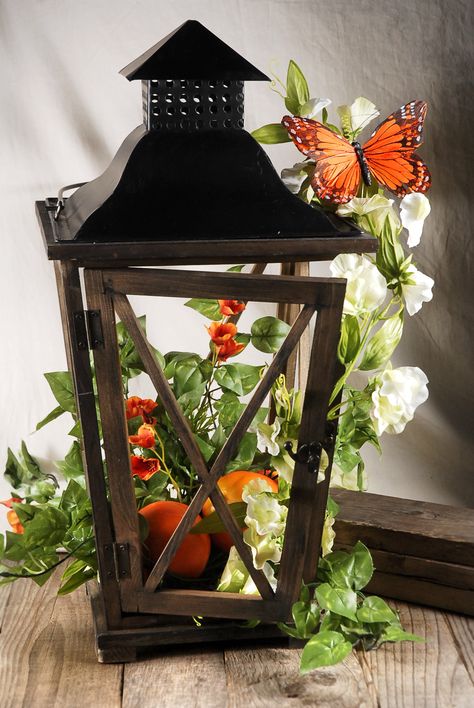 #lantern #butterfly #ivy #floraldecor #centerpiece #weddings #beverlys #beverlyfabrics June Decor, Lamp Centerpieces, Quince Decor, Butterfly Centerpieces, Wedding Top Table, Tinkerbell Birthday, Lantern Centerpiece Wedding, Table Rose, Butterfly Table