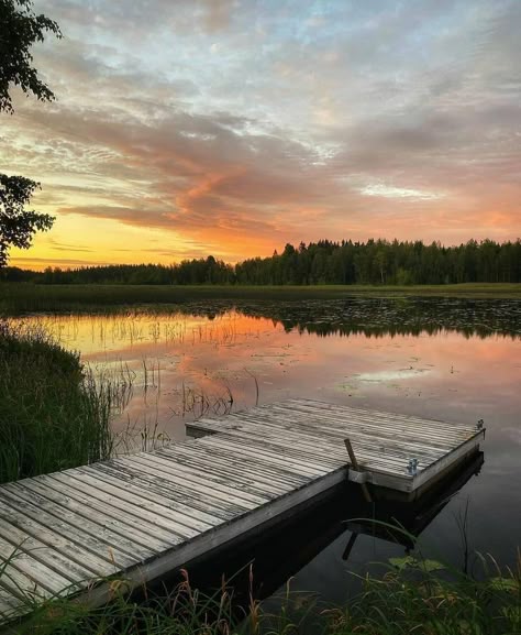 A pier by the lake at sunset in Joutsa in the Jyväskylä Region Sunset On A Lake, Summer Cottage Aesthetic, Finnish Cottage, Lake Aesthetics, Scandinavian Landscape, Tropical Paradise Beach, Summer Camp Aesthetic, Finland Summer, Lake Aesthetic