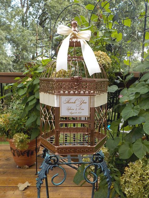 Large Bird Cage Wedding Card Holder. Beautiful Rose Gold Hexagon Birdcage Money Holder with Ivory Satin Ribbon and Gold Text on the sign. Bird Cage Measures 18” tall, 10 wide, and will accommodate 100+ cards, depending upon the size and thickness of each card. Your guests can place Gold Bird Cage, Wedding Money Holder, Gold Card Box, Large Bird Cages, Diy Bird Bath, Shower Cards, Wedding Card Box, Vintage Bird Cage, Wedding Card Holder