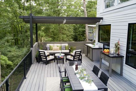 Homeowner's Outdoor Space Features Trex Outdoor LIving Products | Trex Second Level Deck Ideas Outdoor Living, Trex Island Mist Deck Ideas, Second Level Deck Ideas, Second Level Deck, Two Level Deck Ideas, Outdoor Cabinets, Decking Railing, Two Level Deck, Back Porch Designs