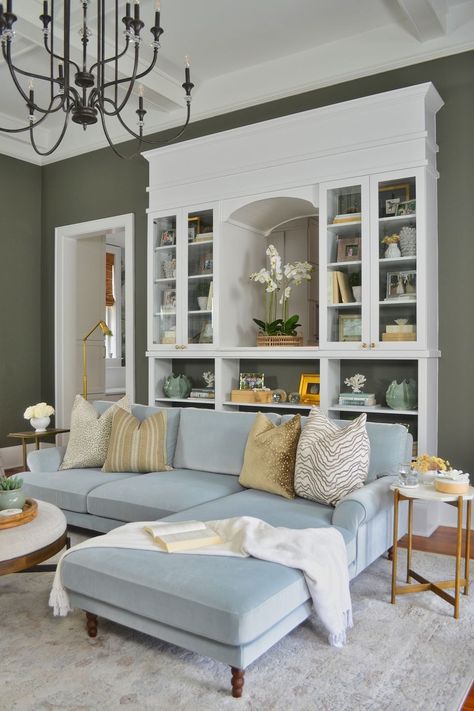 green living room with pale blue couch Built In With Windows, Pale Blue Couch, Trendy Paint Colors, Painted Fireplace, Best Paint Colors, Room Paint Colors, Living Room Green, Paint Colors For Living Room, Furniture Layout