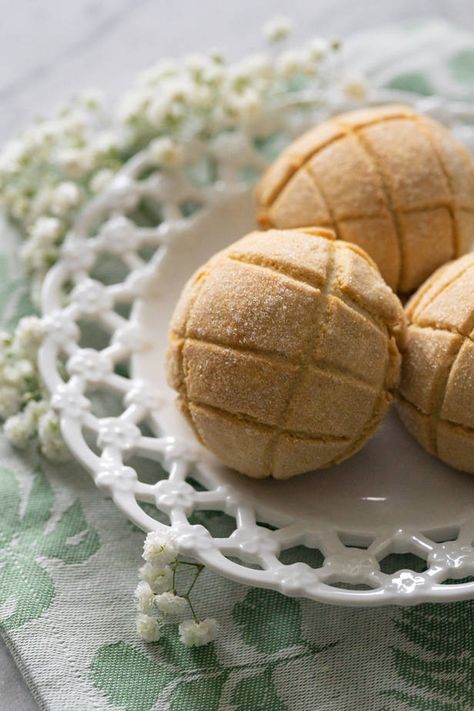 Japanese melon bread is a sweet, fluffy bun covered in a crisp almond cookie crust. This popular snack is such a tasty treat! ~ Coriander & Lace Grape Pasta Salad, Grape Pasta, Fluffy Bun, Melon Bread, Almond Cookie, Poppy Seed Dressing, Popular Snacks, Cookie Crust, Almond Cookies