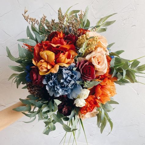 Terracotta And Navy Flowers, Blue Green Orange Flower Arrangement, Red Orange Yellow Blue Wedding, Blue And Orange Flower Arrangements, Blue And Orange Wedding Flowers, Blue And Orange Bouquet, Orange And Blue Bouquet, Faux Wedding Bouquet, Tall Flower Centerpieces