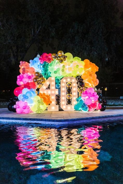 How to Throw an Adults Birthday Party - Lady Celebrations Elegant 80s Party, Lights For Birthday Party, 90s Theme Balloon Garland, Neon Party Outside, 80s Theme Pool Party, Glow Balloon Arch, Neon 40th Birthday Party, 80s And 90s Party Ideas, 90's 40th Birthday Party