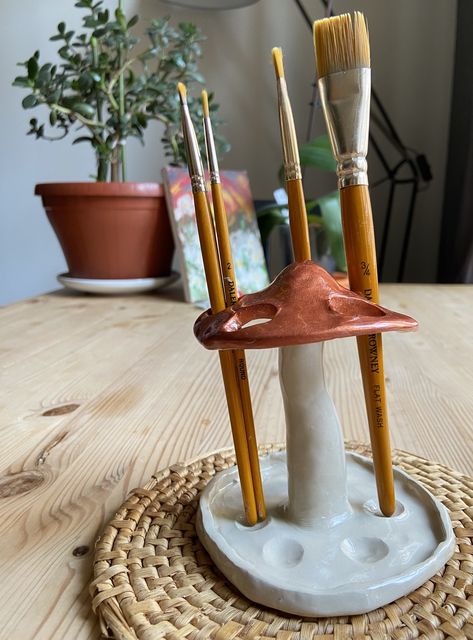 Mushroom pen and brush holder will enhance the aesthetics of any room within your home! 🍄🌱 It is made out of clay, painted and glazed. Check it out on etsy shop: KBmushROOM!💖 #mushroom #clay #gift #handmade Clay Crafts For Room Decor, Pottery Paintbrush Holder, Paint Brush Clay Holder, Clay Gifts For Teachers, Clay Room Decor Aesthetic, Clay Paint Holder, Useful Sculpture, Pen Holder Diy Clay, Clay Make Up Holder