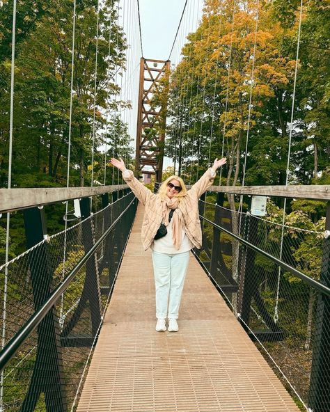 I couldn't wait to cross that bridge, the suspension was killing me. 🌉⁣ ⁣ Leaf Peeper Alert! Swipe through for colors! 🍁⁣ ⁣ The SkyBridge Michigan at Boyne Mountain in Northern Michigan is the longest timber towered suspension bridge in the world! At 1200 feet long and 118 feet high, the SkyBridge offers spectacular views of the Boyne Valley. ⁣ ⁣ Take the chairlift up and walk across to see the fall foliage in its peak right now.⁣ ⁣ We had to wait in a long line to get to the shuttle, and ano... Skybridge Michigan, Carrie Green, Boyne Mountain, Killing Me, Suspension Bridge, Northern Michigan, Fall Foliage, Travel Experience, The Fall