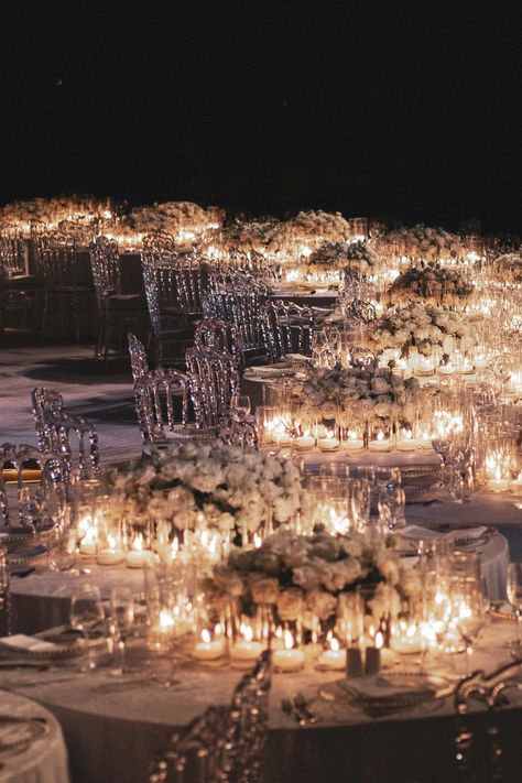 Elegant candlelit wedding reception with luxurious floral arrangements.  #RomanticVibes #WeddingInspiration #CandlelightDinner #EveningElegance #LoveInTheAir #IntimateSetting #TableDecor #WeddingMood #LuxuryPlanner #DestinationWedding #IndianWeddingPlanner #LuxuryFlowers #LuxuryDestination #WeddingPlanning #LuxuryFlorals #FloralDesign #LuxuryVenue #DreamWedding #EventStyling #IndianWeddingDecor#LuxuryWeddingDetails #DestinationWeddingVenue #WeddingCeremony#ElegantMandap #SJSEvents Intimate Candlelit Wedding Reception, Indian Wedding Sangeet Decor, Luxury Wedding Decor Reception Decorations, Candle Lit Wedding Reception Romantic, Wedding Reception Lights, Wedding Reception Ideas Indoor Elegant, Candle Lit Wedding Reception, Candlelight Wedding Reception, Candlelit Wedding Ceremony