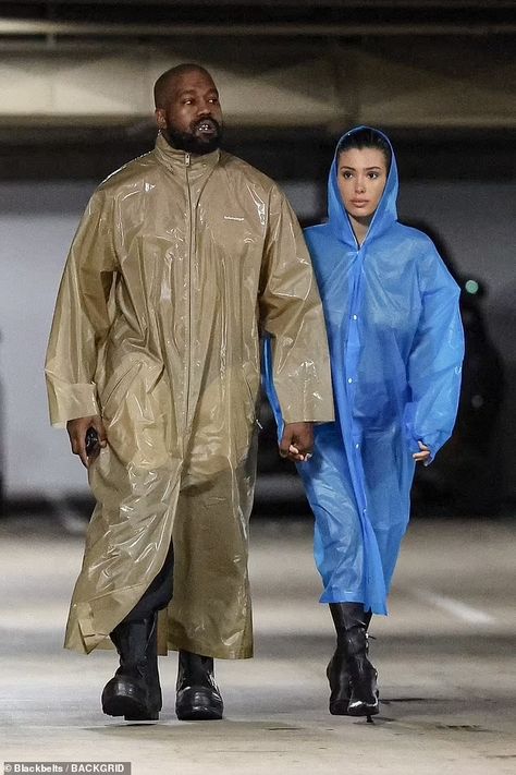 Bianca Censori struggles to protect her modesty as she goes NUDE under a clear raincoat for a studio session with mask-clad husband Kanye West | Daily Mail Online Kanye West Closet, Controversial Fashion, Kanye West Show, Kanye West Wife, Clear Raincoat, Mesh Outfit, Balenciaga Jacket, Kim And Kanye, Century City