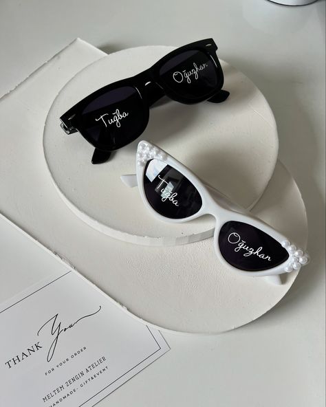 Tuğba & Oğuzhan 🤍 ✨ **Personalized Sunglasses Set** ✨ Make your special moments even brighter with our custom-made sunglasses! Whether it’s a wedding, bachelorette party, or any occasion, add a unique touch with these personalized designs. 🕶️✨ 🔹 **Classic Black for Groom** - A sleek, timeless look with custom engraving. 🔹 **Glamorous White for Bride** - Elegant white frames embellished with pearls for a chic, luxurious feel. These handmade sunglasses are perfect for couples who want to s... Bride Sunglasses Wedding, Groom Sunglasses, Bride Elegant, Personalized Sunglasses, Handmade Sunglasses, Wedding Bachelorette Party, White Frames, Pearl Wedding, Special Moments