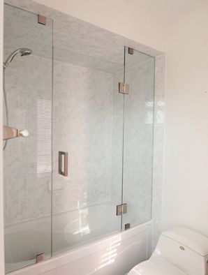 Like these glass doors for the hallway shower/bath Glass Frameless Shower Doors, Glass Tub Enclosure, Glass Shower Tub, Shower Door Glass, Bathroom Tub Shower Combo, Basement Bathroom Design, Bathroom Shower Doors, Tub Enclosures, Guest Bathroom Remodel