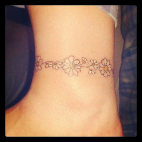 Inspiration for Tangie's memorial daisy tattoo. Daisy Chain Tattoo Ankle, Daisy Chain Tattoo, Anklet Tattoo, Daisy Tattoo Designs, Daisy Flower Tattoos, Wrist Bracelet Tattoo, Chain Tattoo, Ankle Bracelet Tattoo, Ankle Tattoo Designs