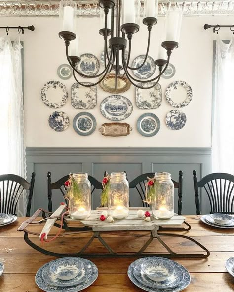 A vintage farmhouse dining room with paneled walls, a stained table, black chairs, a vintage plate wall and a chic chandelier Plates On The Wall, Scandinavian Home Interiors, Plate Wall Decor, White Dining Room, Plate Wall, Plate Decor, Luxury Homes Interior, Farmhouse Dining Room, Indian Home Decor