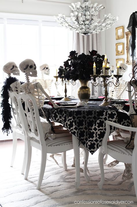 Halloween dining room skeleton party from confessionsofaserialdiyer.com Halloween Dinner Table Decor Dining Room, Skeleton Kitchen Decor, Dining Room Halloween Decor, Halloween Dining Room Decor, Halloween Dining Table Decor, Witchy Party, Halloween Entertainment, Halloween Home Decor Ideas, Skeleton Party