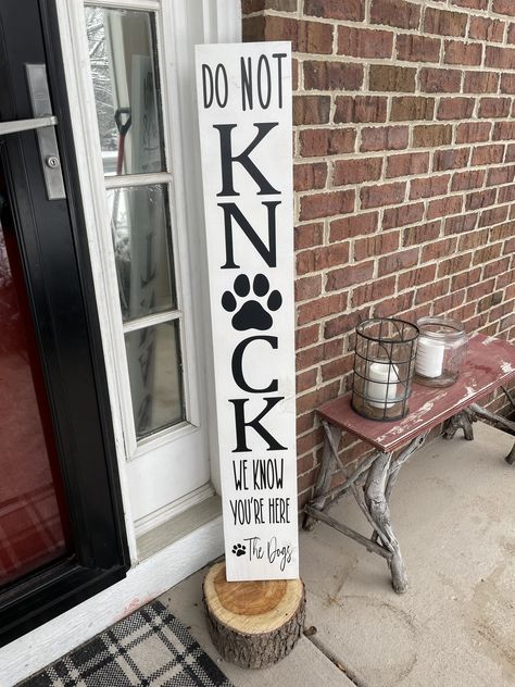 "Do NOT Knock We Know You're Here, The Dog(s)  Front Porch Welcome Sign Yep, Your dog(s) know someone is there! No need to knock  This photo listing is #5 white. Other color options are available. Please check our photos for color chart.  Feature this personalized sign in or outside your home. This will be the perfect gift or addition to your home. Great for any season too! Comes in a variety of colors to match any porch, home or placed area.  💛 SIGN 💛 is hand stained or painted with vinyl lettering and sealed. All of our signs are unique. We allow the natural beauty of the wood to show through, so expect slight variations in the color, grain, knots, etc. Although the sign can withstand the elements, it is recommended they are not in direct constant sunlight.  💛 DIMENSIONS 💛   The sign Dog Front Porch Sign, Dog Porch Signs Diy, No Knocking Sign Front Doors, Front Door Signs Wooden Rectangle, Dog Welcome Sign Front Doors, Dog Porch Signs, Dog House Sign, Unwelcome Porch Sign, Funny Pet Signs