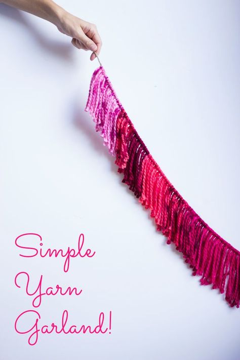 These yarn garlands are simple enough for kids to make and make such pretty decor and party decorations | http://www.designimprovised.com Knitting Party Decorations, Cheap Christmas Decor Diy, Diy Ribbon Garland, Diy Yarn Garland, Wool Garland, Yarn Garland, Making Yarn, Diy Tapestry, Office Diy