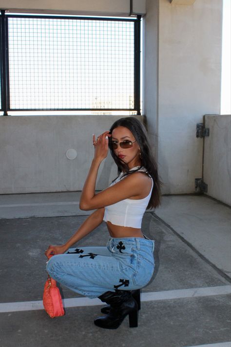 girl taking a picture in a parking garage dressed y2k in chrome hearts jeans black boots white tank top and chanel vintage rimless glasses Cute Urban Outfits, Instagram Outfit Ideas Baddie, Instagram Ideas Baddie, Baddie Photoshoot Ideas At Home, Photoshoot Ideas Baddie, Ig Picture Ideas, Parking Garage Photoshoot Aesthetic, Picture Ideas Baddie, Baddie Photoshoot Ideas