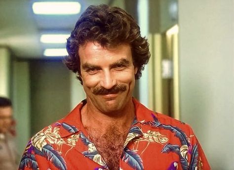 Tom Selleck gives the famous Thomas Magnum smile on the TV show "Magnum, P.I.", 1980's. Tom Selleck Mustache, Thomas Magnum, Jesse Stone, Mustache Men, 80s Tv, Smokey And The Bandit, Magnum Pi, Cop Show, Burt Reynolds