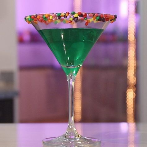 Indulge your inner child with this sweet and colorful Nerds Martini, perfect for candy lovers and cocktail enthusiasts alike! Nerds Candy Cocktail, Candy Cocktails, Melon Liqueur, Nerds Candy, Tipsy Bartender, Lemon Lime Soda, Alcohol Drinks, Blue Curacao, Martini Cocktail