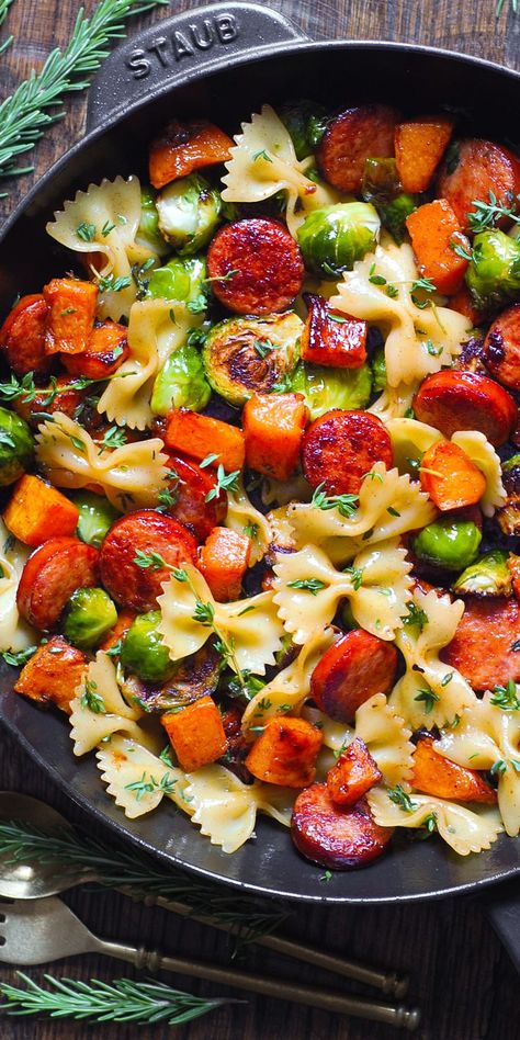 Autumn Dinner with Sausage, Pasta, Veggies, and Garlic Butter Sauce in a cast iron pan. Turkey Sausage And Brussel Sprouts, Andouille Sausage Butternut Squash, Fall Bowtie Pasta, Sausage Brussel Sprouts Pasta, Vegan Sausage Pasta Recipes, Bow Tie Sausage Pasta Recipes, Sausage And Bow Tie Pasta Recipe, Butternut Squash Sausage Recipes, Butternut Squash Sausage Pasta