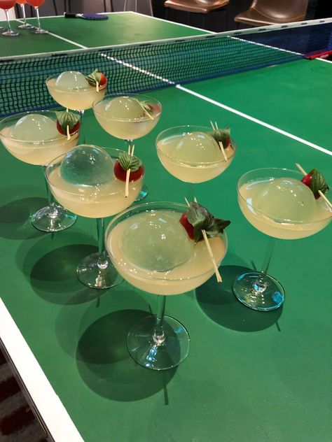 Cocktail idea for tennis themed party - round ice served on green ping pong table Tennis And Tequila, Country Club Party Theme, Tennis Bachelorette Party, Tennis Cocktail, Tennis Themed Party, Wimbledon Recipes, Wimbledon Party, Tennis Wimbledon, Tennis Birthday