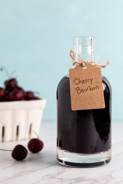 Cherry Bourbon - oh my this is the most delicious infused bourbon ever!! Sweet and spicy and perfect for cocktail, though I even like sipping it all by itself! Make a few batches because it makes a great gift!! #cherrybourbon #cherrywhiskey Homemade Liqueur, Infused Bourbon, Cherry Whiskey, Cherry Bourbon, Bourbon Liquor, Bramble Cocktail, Infused Liquors, Spicy Candy, Bourbon Cherries