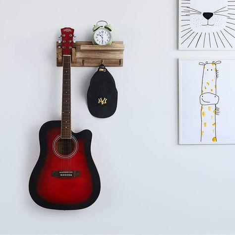 "Buy the NEX™ Wood Guitar Wall Hanger with Shelf & 3 Hooks at Michaels. com. It is a multifunctional wall mounted guitar hanger, you can place guitar accessories such as tuners, spare strings, picks, guitar straps, pin puller and more on it. Put your guitar neck on the holder to hanging your guitar. Display your guitar on the wall and find it quickly. Easy to place the guitar, and make full use of the wall space, save your cupboard space. It is a multifunctional wall mounted guitar hanger, you c Guitar Hooks Wall Mount, Hanging Guitars On Wall Ideas, Hang Guitar On Wall, Guitar Hanging Ideas, Mounted Guitar, Hanging Guitars, Guitar Hook, Music Room Design, Guitar Storage