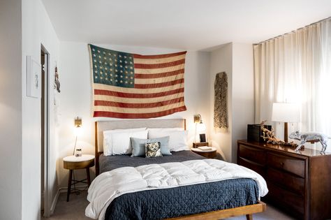 American Flag Above Bed, American Flag In Bedroom, Flags In Bedroom, Decorating With Flags, American Bedroom, Rustic Farmhouse Bedroom, A Studio Apartment, Tony Award, Theater District