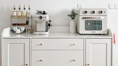 IKEA Cabinets That Are Perfect For Turning Into A DIY Coffee Bar Coffee Cabinet Ikea, Ikea Diy Coffee Bar, Havsta Coffee Bar, Ikea Kitchen Coffee Bar, Ikea Hacks Coffee Bar, Ikea Base Cabinet Hack, Ikea Coffee Bar Ideas, Ikea Skruvby Hack, Coffee Buffet Station