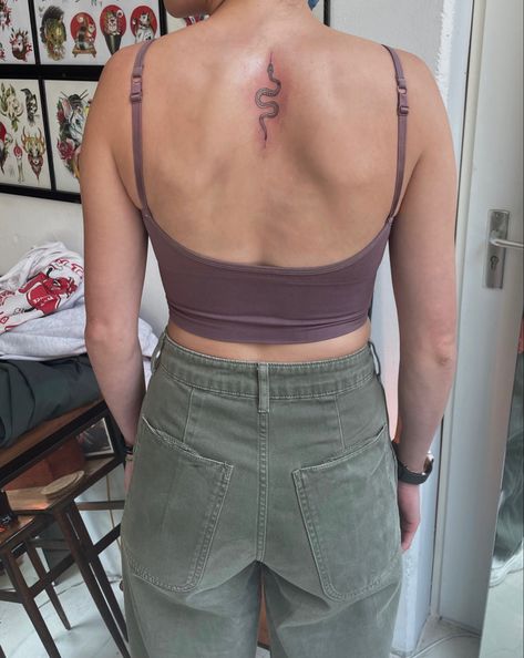 Upper back snake tattoo small tattoo Small Snake Spine Tattoo, Snake Tattoo Upper Back, Simple Upper Back Tattoo Women, Spine Tattoo Snake, Back Snake Tattoo, Snake Spine Tattoo, Small Snake Tattoo, Small Snake, Upper Back Tattoos