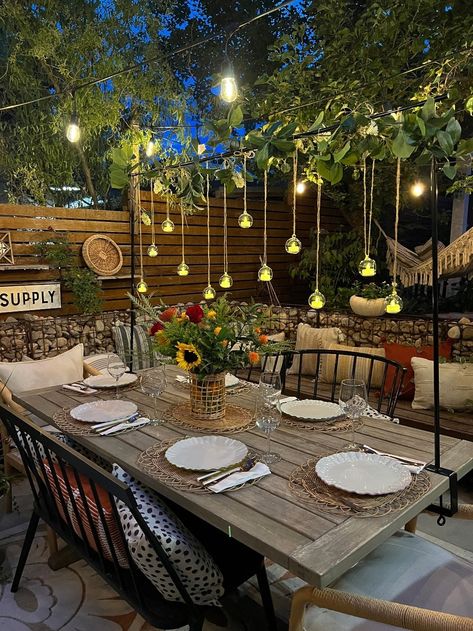 String Lights Over Outdoor Dining Table, Garden Table Lighting Ideas, Lights Over Picnic Table, Floating Garland Above Table, Outdoor Party Table Decorations, Hanging Decor Over Table, Patio Decorating Ideas Lights, Over The Table Decorating Rod, Over The Table Flower Rod