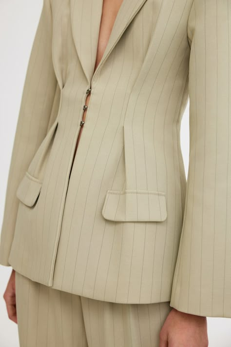 Signature suiting in a staple new colour way this season ~ the Ebony Blazer in Sage Pinstripe is designed to be fitted at the waist and relaxed throughout. Complimented with full length sleeves, pocket flaps, hook and eye closure and wide lapels. PRODUCT DETAILS - Blazer silhouette- Lined- Pocket flaps- Pleats through Blazer Details Women, Soft Tailoring Women, Blazer Tailoring, Cinched Blazer, Blazer 2024, Unique Suits, Modeling Clothes, Blazer Details, Blazer Design