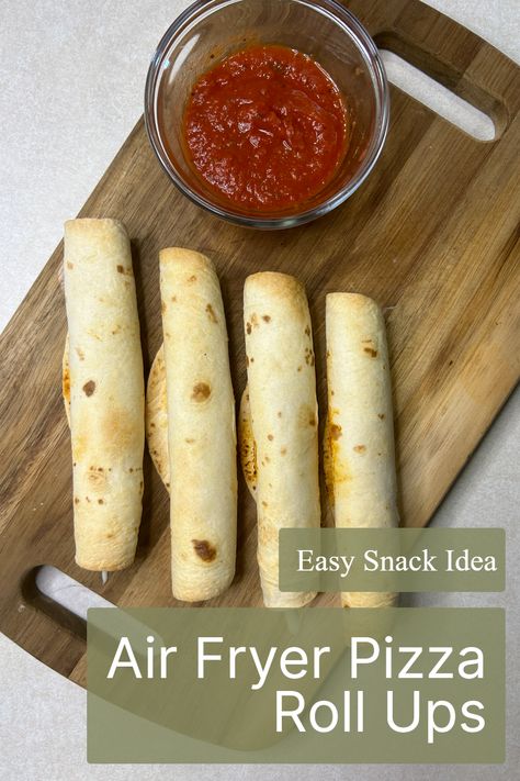 Satisfy your pizza cravings with the delicious Air Fryer Pizza Roll Ups! This Pinterest-famous appetizer features tortillas, mozzarella cheese, and pepperoni, all rolled up for a snack that's as fun as it is tasty. Discover the magic of this easy air fryer recipe, and be sure to save it for your next snack time adventure! Air Fryer Pizza Roll Ups With Tortilla, Pepperoni And Mozzarella Roll Ups, Easy Air Fryer Pizza Roll Ups, Air Fryer Pepperoni Pizza Crescent Rolls, Dehydrate Air Fryer Recipes, Airfryer Pizza Rolls, Tortilla Pizza Rolls, Air Fryer Pizza Roll Ups, Pizza Rolls In Air Fryer