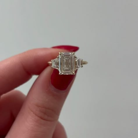 Shahla Karimi on Instagram: "Custom 3 Stone Emerald + Trapezoids Engagement Ring 🤍  . . . . . #diamonds #engaged #engagementring #jewelryinspo #jewelryinspiration #proposal #customenagementring #customring #emeraldcut" Emerald With Trapezoid Side Stones, Vintage Emerald Cut Engagement Rings, Ring Vision Board, Vintage Silver Engagement Rings, Coloured Stone Engagement Rings, Shahla Karimi, Manifesting Crystals, Big White Wedding, Emerald Engagement Ring Vintage