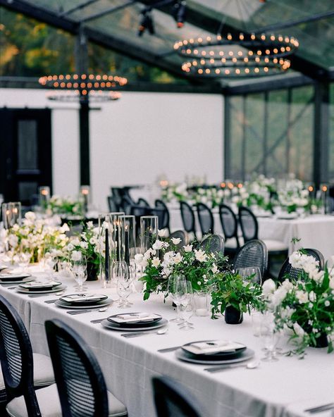 Martha Stewart Weddings on Instagram: “This couple wanted "a clean, modern tent that felt more like a hip urban restaurant," they say, so they requested black stained wood beams…” Black White Outdoor Wedding, Black Tent Wedding, Black And White Tent Wedding, Theoni Collection, White Wedding Table Setting, Stained Wood Beams, White And Black Wedding, Black And White Wedding Theme, White Wedding Theme