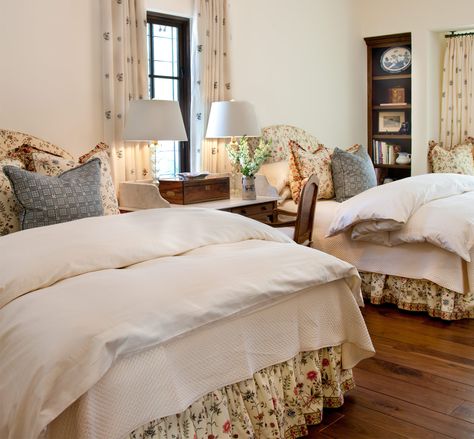 An French antique vanity graces this charming guest bedroom featuring upholstered headboards, dust skirts, and Euro shams in Pierre Frey fabric. 2 Twin Bedroom Ideas, Double Queen Bedroom, Double Bed Guest Room, Twin Bed Guest Bedroom, Cozy White Room, Cottage Bedroom Twin Beds, Twin Beds Guest Room Antique, 2 Twin Beds In Attic, Two Twin Beds In One Room