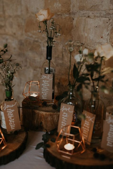 Rustic Wedding Seating Chart at Winter Wedding | By Virginia Photography | Seating Chart | Wedding Table Plan | Wedding Decor | Rustic Wedding Decor | Tree Slice Wedding Decor  | Barn Wedding | Winter Wedding | Rustic Wedding | Seating Chart Wedding Winter, Bottle Seating Chart Wedding, Rustic Table Plan, Rustic Seating Chart Wedding, Wine Bottle Seating Chart, Vintage Seating Chart, Seating Plan Wedding Rustic, Table Chart Wedding, Bottle Seating Chart