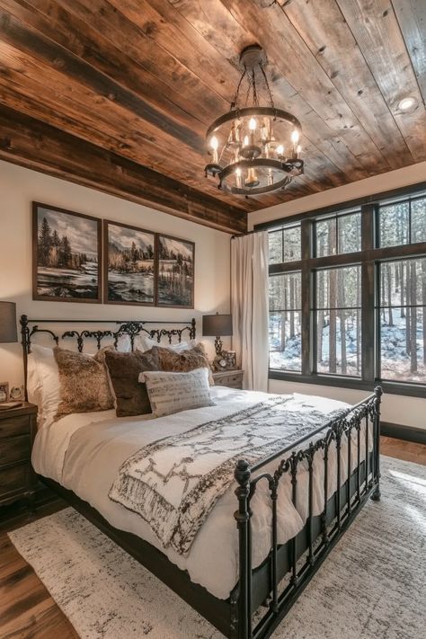 Rustic-chic bedroom. Shiplap ceiling with a distressed black iron frame bed.  Welcome to the latest trend in home design that combines both style and functionality seamlessly - modern farmhouse sleeping spaces with sliding barn doors! This rustic-chic decor has taken the interior design world by storm, promising a unique blend of snug comfort and stylized appeal. You definitely won't be disappointed!…  Read more: https://tastyinteriors.com/generated-post-73-modern-farmhouse-sleeping-spaces-sliding-barn-doors/ Bedroom Ideas Barndominium, Rustic Guest Room Ideas, Barn House Bedroom Ideas, Barndo Bedroom Ideas, Barndominium Ideas Interiors Bedroom, Dream Farmhouse Bedroom, Country Master Bed, Barndominium Bedroom Ideas, Barndominium Bedroom