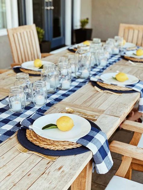 Lemon, blue and white table setting: Take up your summer BBQ decor by adding citrus to the table! Using natural elements is a great way to elevate your tablescape and add a bit of flair to your summer table. Summer Bbq Decorations, Themed Tablescapes, Lemon Tablescape, Picnic Table Decor, Bbq Decor, Farm Table Decor, Summer Table Decor, Gingham Party, Summer Table Decorations