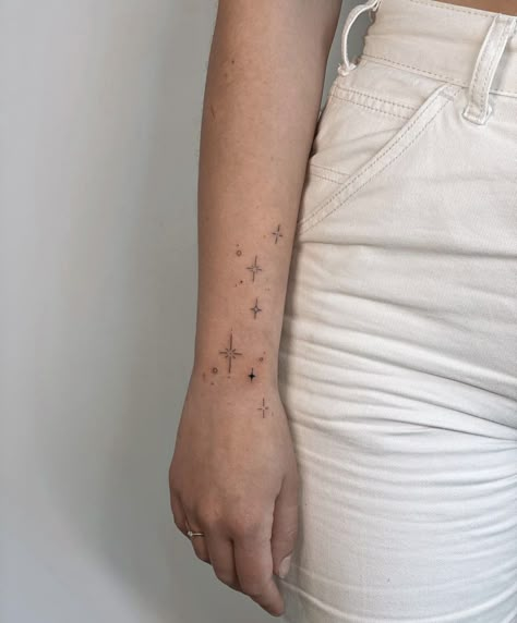 Star Arm Wrap Tattoo, Stars On Forearm Tattoo, Back Of Arm Star Tattoo, Stars Wrap Around Tattoo, Wrist Stars Tattoo, Star Tattoos For Women On Wrist, Arm Tattoos For Women Stars, Constellation Arm Tattoo, Starry Hand Tattoo