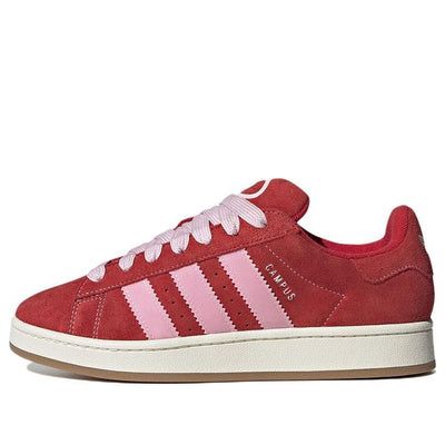 The adidas originals Campus 00s 'Red Pink White' is a modern take on the iconic silhouette. With a vibrant red base and pink and white accents, this sneaker is perfect for any occasion. Whether you're celebrating friendship or love, this sneaker is sure to make a statement. The rubber sole provides extra comfort and durability, making it the perfect choice for any activity. The Campus 00s series brings a fresh look and style to the classic adidas design, making it a must-have for any sneaker ent Red And Pink Adidas Campus, Red And Pink Campus 00s, Cute Red Shoes, Pink Adidas Shoes, Celebrating Friendship, Adidas Campus 00s, Red Trainers, Adidas Design, Classic Adidas