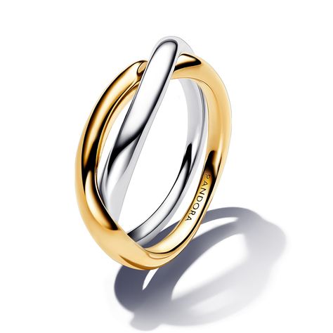 From Pandora, two tones are better than one with the Two-Tone Entwined Bands Ring. This ring features two slightly wavy rounded bands - one sterling silver and one 14k gold-plated - that overlap and intertwine with one another. The best part about this sleek, sculptural style is that you don't have to choose your favorite metal because it features both, making it an extra versatile addition to your own collection or as a gift for a loved one. Pandora Style #: 163262C00-56 Two Toned Rings, Two Toned Ring, Mixing Jewelry Metals, Silver And Gold Ring Stack, Two Toned Jewelry, Mixed Metal Ring Stack, Pandora Rings Gold, Rings Silver And Gold, Mixed Metals Jewelry Style