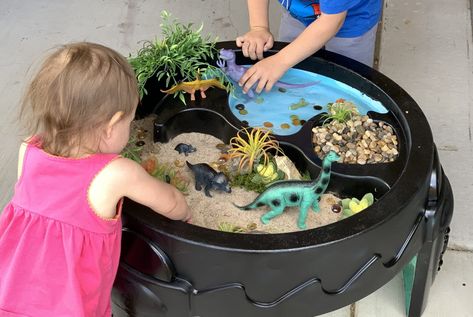 Upcycle Your Water Table Into a Dinosaur World Spray Paint Water Table, Water Table Makeover, Water Table Sensory Play, Dinosaur World, Hot Wheels Party, Kids Eat Free, Swimming Classes, Dinosaur Activities, Sand Table