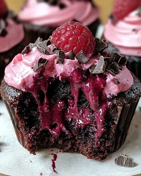 Raspberry Chocolate Lava Cupcakes 🍫🍇 Ingredients: For the Cupcakes: - 1/2 cup unsalted butter - 6 oz semi-sweet chocolate, chopped - 1/4 cup granulated sugar - 2 large eggs - 1/4 cup all-purpose flour - 1 tsp vanilla extract - 1/4 cup raspberry preserves For the Filling: - 6 fresh raspberries - 2 oz dark chocolate, chopped For the Topping: - Powdered sugar (for dusting) - Fresh raspberries Instructions: 1. Preheat the oven to 425°F and grease a muffin tin or line with cupcake liners. 2.... Dark Desserts, Chocolate Lava Cupcakes, Lava Cupcakes, Dark Chocolate Cupcakes, Raspberry Cupcakes, Raspberry Chocolate, Raspberry Preserves, Chocolate Lava, Fresh Raspberries