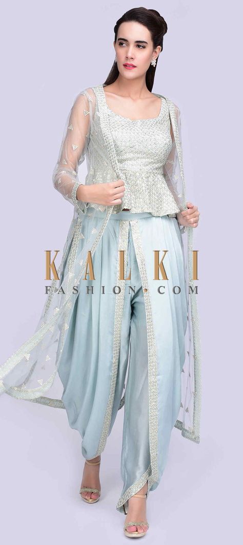 Buy Online from the link below. We ship worldwide (Free Shipping over US$100) Click Anywhere to Tag Ice blue embroidered peplum top with matching dhoti and long net jacket only on Kalki Ice blue georgette peplum top with thread and sequins jaal embroidery.It has a matching satin dhoti pant with an additional top layer with pleats.The set is teamed with a matching long net jacket with embroidered butti. Dhoti With Peplum Top, Dhoti Pants Outfit Wedding, Latest Dhoti Style Dress, Dhoti Design, Dhoti Pants Outfit, Dhoti Style Dresses, Net Jacket, Peplum Top Outfits, Dhoti Salwar